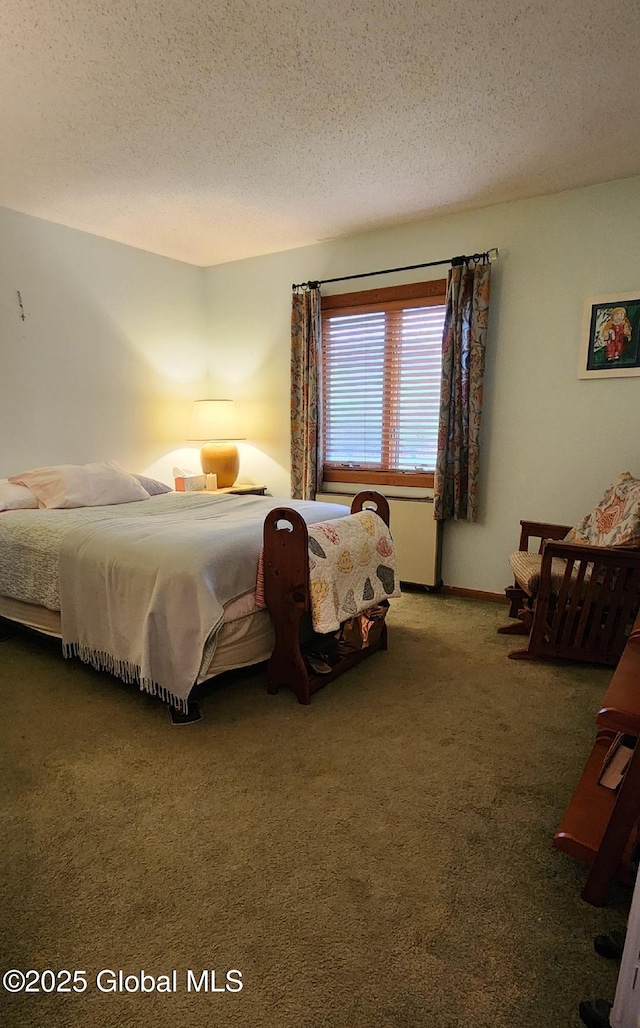 carpeted bedroom with a textured ceiling