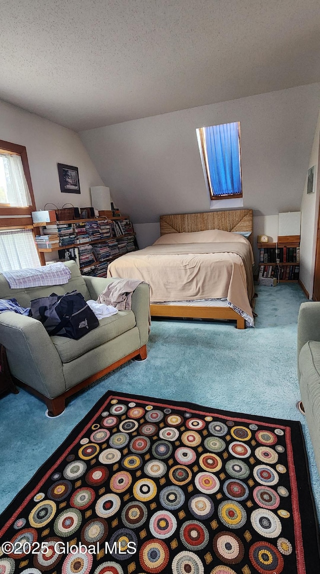 carpeted bedroom featuring lofted ceiling and a textured ceiling