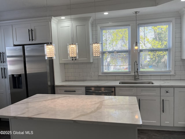 1441 Richard St, Schenectady, NY 12303 - kitchen with decorative backsplash, stainless steel fridge, a sink, pendant lighting, and dishwashing machine