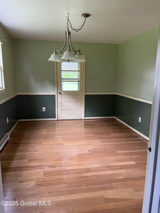 13 Pine Hill Ln, Fort Ann, NY 12827 - spare room with plenty of natural light, wood finished floors, baseboard heating, and baseboards
