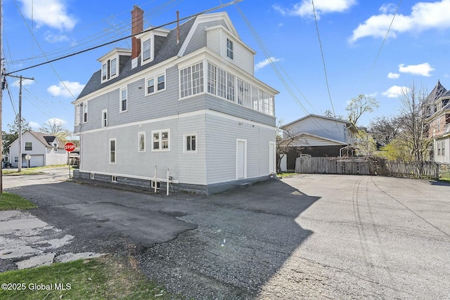 1261-1263 The Plz, Schenectady, NY 12308 - view of side of home with fence and a chimney
