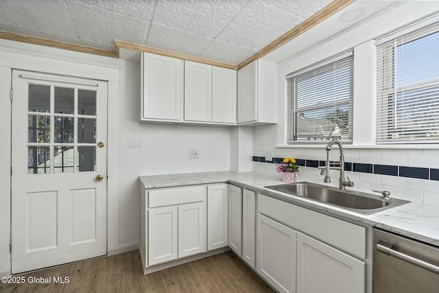 1261-1263 The Plz, Schenectady, NY 12308 - kitchen featuring dishwasher, a sink, wood finished floors, white cabinets, and an ornate ceiling