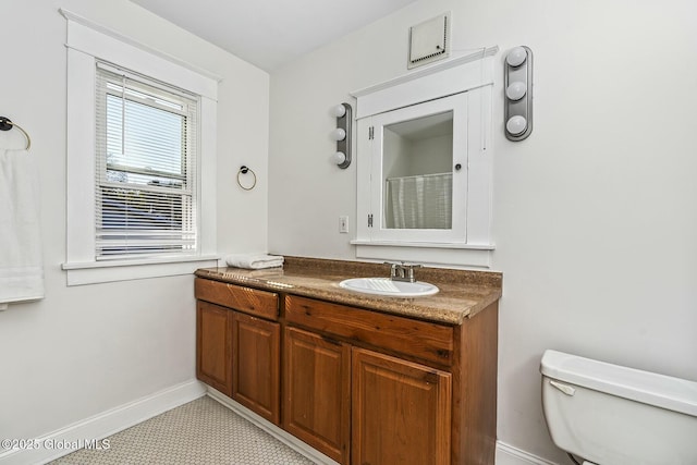 1261-1263 The Plz, Schenectady, NY 12308 - bathroom featuring baseboards, toilet, vanity, and a shower with shower curtain