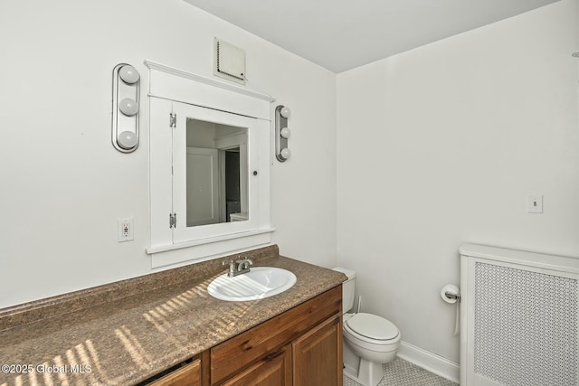 1261-1263 The Plz, Schenectady, NY 12308 - half bathroom featuring radiator heating unit, vanity, toilet, and tile patterned floors
