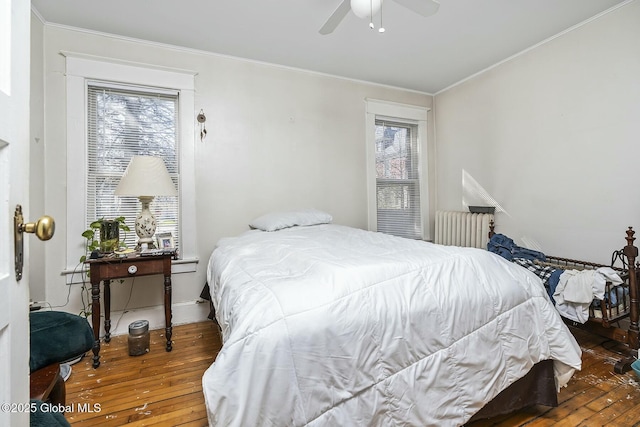 1261-1263 The Plz, Schenectady, NY 12308 - bedroom with wood-type flooring, crown molding, radiator, baseboards, and a ceiling fan