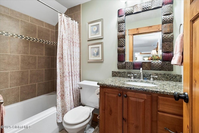 bathroom featuring toilet, shower / tub combo, and vanity