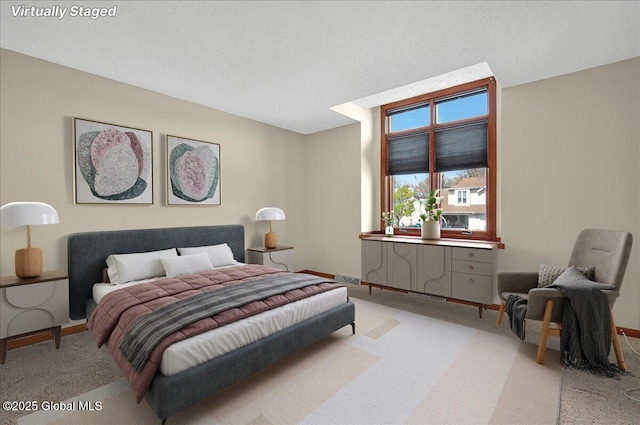 bedroom featuring light colored carpet