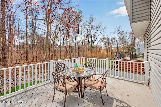 wooden deck with outdoor dining area