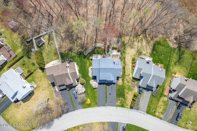 birds eye view of property with a residential view