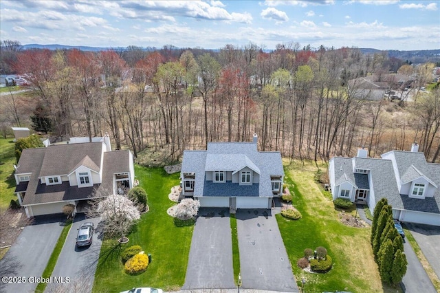 aerial view with a forest view and a residential view