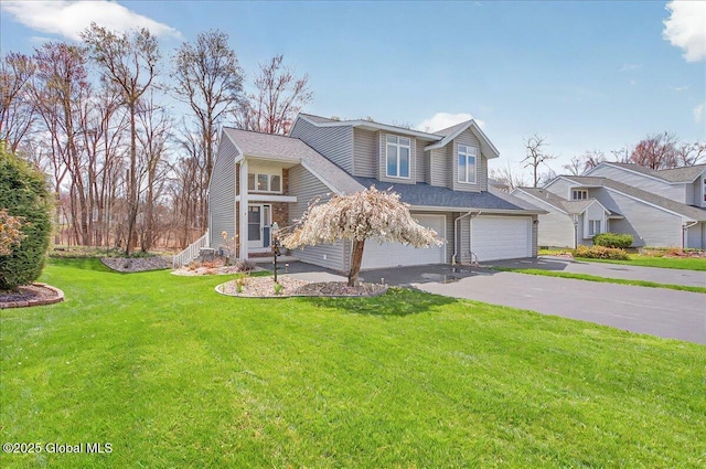 traditional-style home featuring an attached garage, aphalt driveway, and a front yard