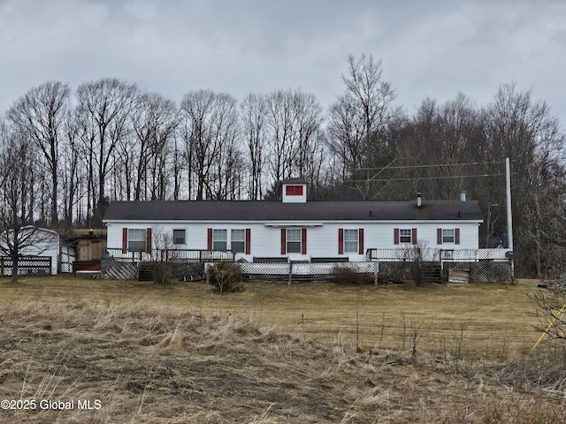 manufactured / mobile home featuring a wooden deck
