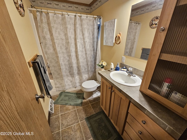 bathroom featuring shower / bath combo with shower curtain, toilet, tile patterned flooring, and vanity