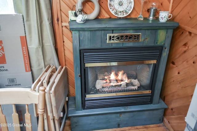 185 Old Schroon Rd, Schroon, NY 12870 - interior details with wood walls and a glass covered fireplace