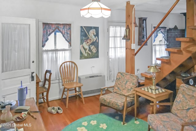 185 Old Schroon Rd, Schroon, NY 12870 - sitting room featuring stairway, wood finished floors, and heating unit