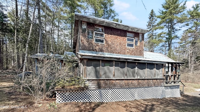 185 Old Schroon Rd, Schroon, NY 12870 - view of property exterior with a sunroom