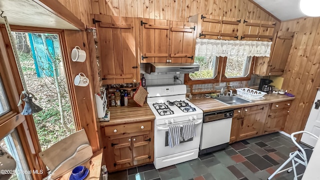 185 Old Schroon Rd, Schroon, NY 12870 - kitchen with a sink, under cabinet range hood, dark floors, wood walls, and white appliances