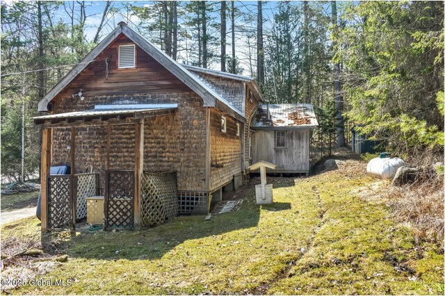 185 Old Schroon Rd, Schroon, NY 12870 - view of home's exterior with a lawn