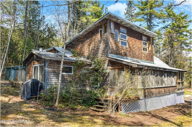 185 Old Schroon Rd, Schroon, NY 12870 - back of property with a chimney
