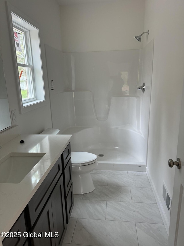 2 Birch Dr, Moreau, NY 12828 - full bathroom with vanity, toilet, marble finish floor, visible vents, and walk in shower