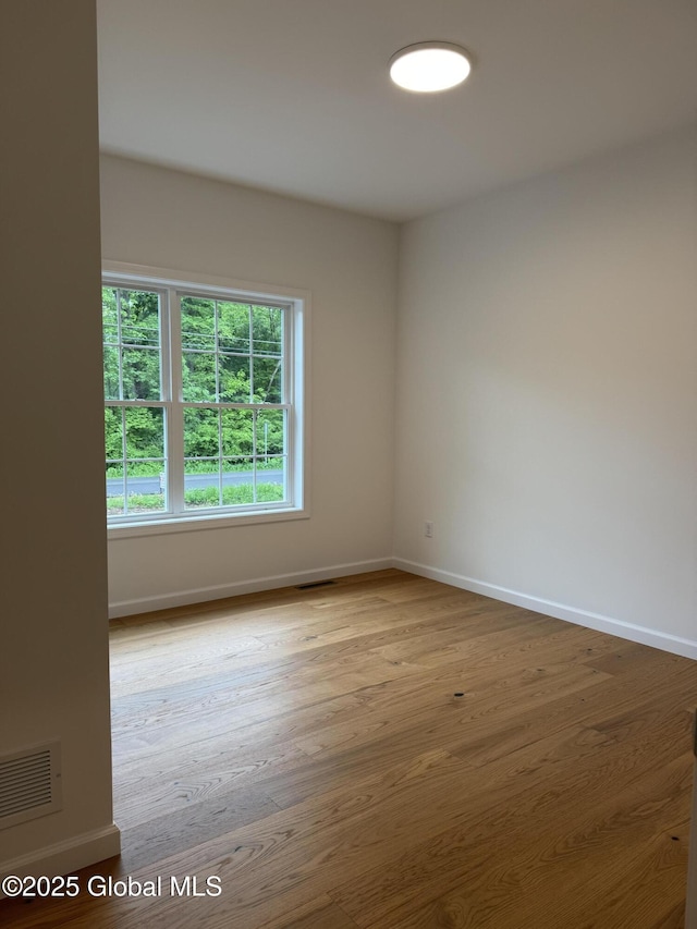 2 Birch Dr, Moreau, NY 12828 - unfurnished room featuring baseboards and wood finished floors