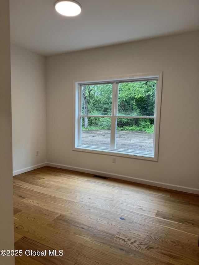 2 Birch Dr, Moreau, NY 12828 - unfurnished room with wood finished floors