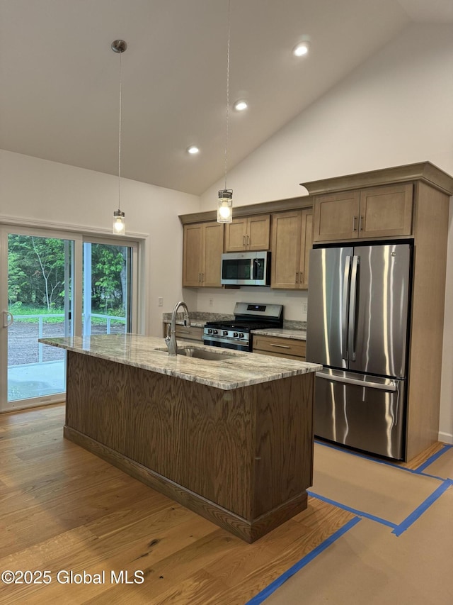 2 Birch Dr, Moreau, NY 12828 - kitchen with appliances with stainless steel finishes, vaulted ceiling, light stone counters, light wood-type flooring, and decorative light fixtures