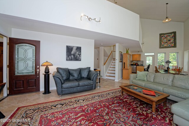 107 Wilderness Way, Stephentown, NY 12169 - living area featuring a high ceiling and stairs