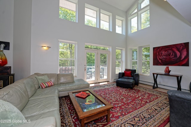 107 Wilderness Way, Stephentown, NY 12169 - living room with a high ceiling, french doors, baseboard heating, and a baseboard heating unit