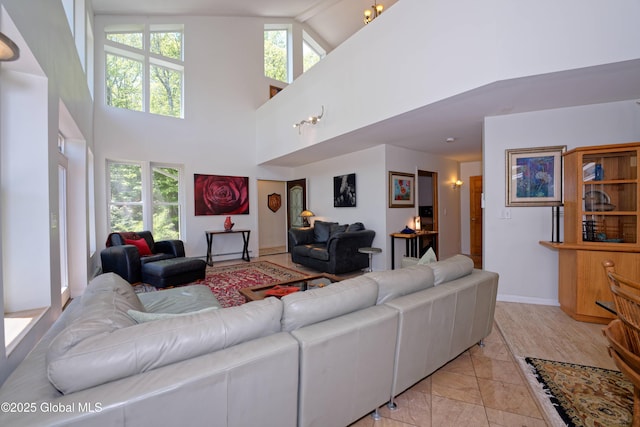 107 Wilderness Way, Stephentown, NY 12169 - living room featuring healthy amount of natural light, high vaulted ceiling, and light marble finish flooring