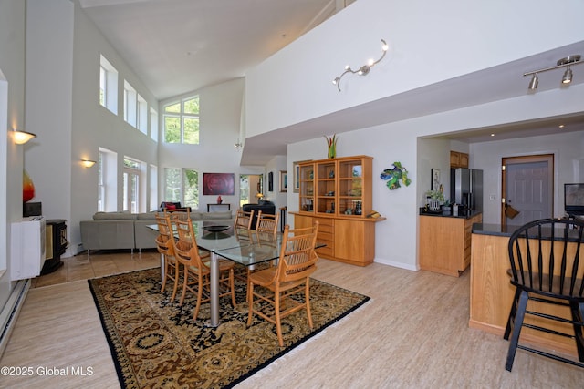 107 Wilderness Way, Stephentown, NY 12169 - dining space featuring light wood-type flooring and high vaulted ceiling