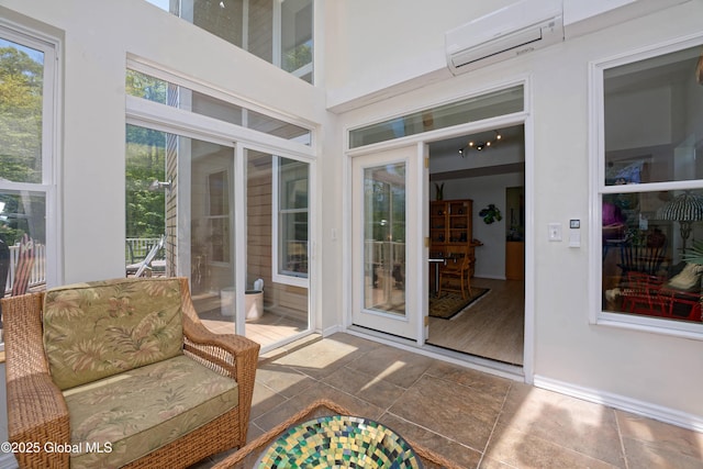 107 Wilderness Way, Stephentown, NY 12169 - sunroom featuring an AC wall unit and baseboards