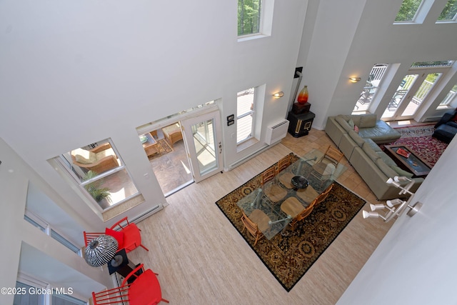 107 Wilderness Way, Stephentown, NY 12169 - living area with a high ceiling, plenty of natural light, and wood finished floors