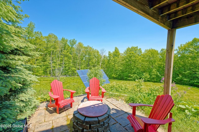 107 Wilderness Way, Stephentown, NY 12169 - view of patio / terrace with a fire pit and a wooded view