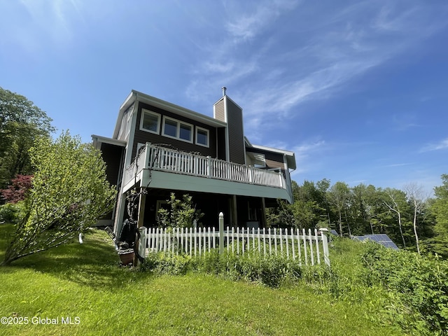 107 Wilderness Way, Stephentown, NY 12169 - back of property featuring a chimney and a balcony