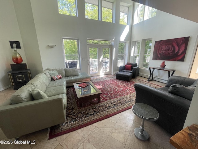 107 Wilderness Way, Stephentown, NY 12169 - tiled living room with a towering ceiling and a wood stove
