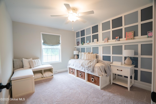 carpeted bedroom with baseboards and a ceiling fan