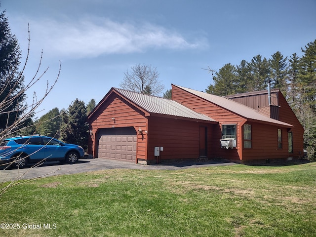 1486 County Highway 112, Caroga, NY 12032 - view of home's exterior with a yard, an attached garage, metal roof, and a chimney