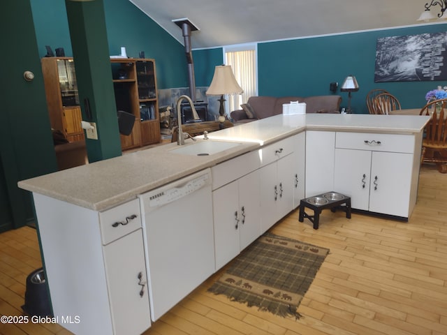 1486 County Highway 112, Caroga, NY 12032 - kitchen with light wood-style floors, white dishwasher, light countertops, white cabinetry, and a sink