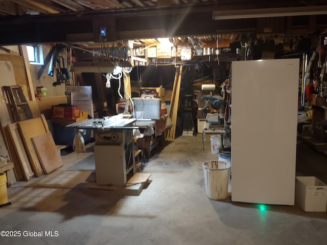 1486 County Highway 112, Caroga, NY 12032 - unfinished basement with freestanding refrigerator and a workshop area