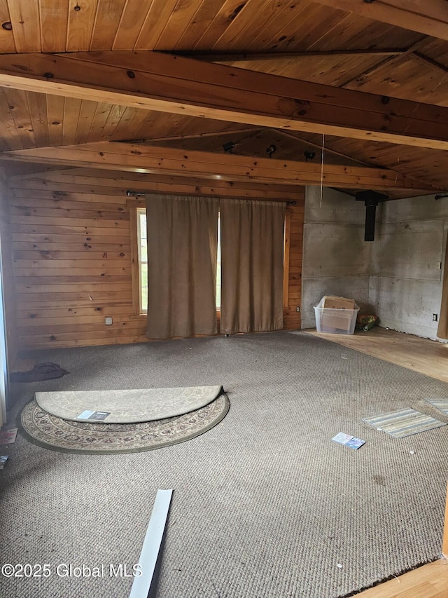 unfurnished living room with beamed ceiling and wooden ceiling