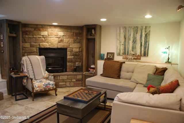 living area with recessed lighting and a fireplace