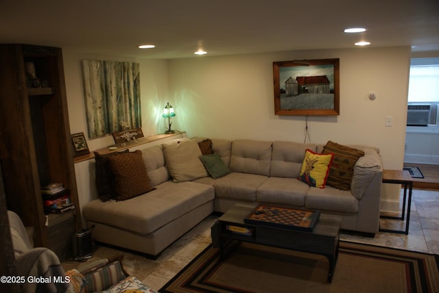 living area featuring cooling unit and recessed lighting