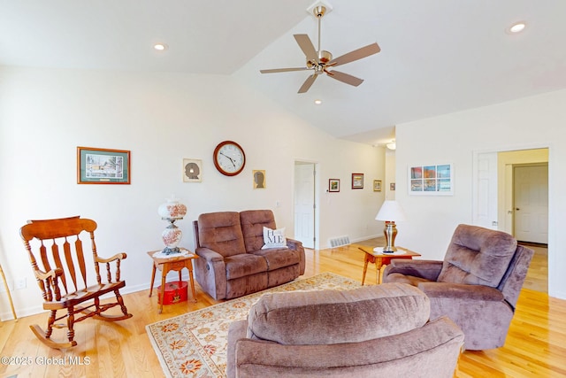 living area featuring visible vents, lofted ceiling, recessed lighting, light wood-type flooring, and a ceiling fan