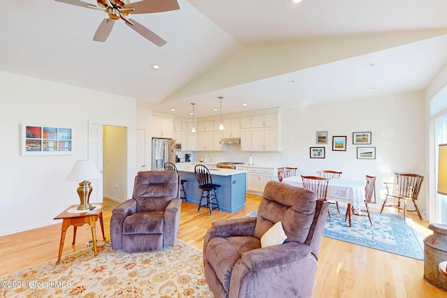 living room with recessed lighting, light wood-style flooring, and ceiling fan