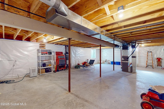 unfinished basement featuring heating unit