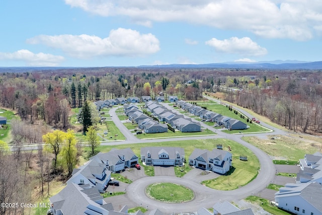aerial view with a residential view and a wooded view