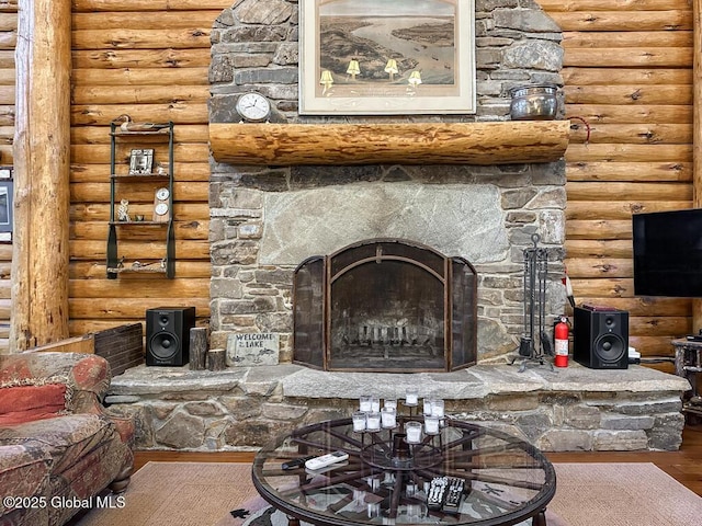 25 Birch Dr, Bolton, NY 12824 - living room featuring log walls, wood finished floors, and a stone fireplace