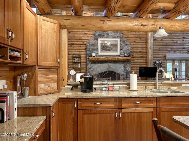 25 Birch Dr, Bolton, NY 12824 - kitchen featuring a sink, rustic walls, brown cabinetry, beamed ceiling, and light stone counters