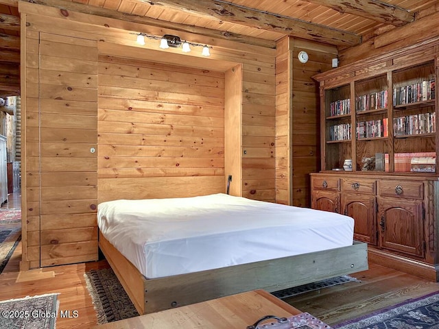 25 Birch Dr, Bolton, NY 12824 - bedroom featuring wooden ceiling, beamed ceiling, wood walls, and light wood-type flooring